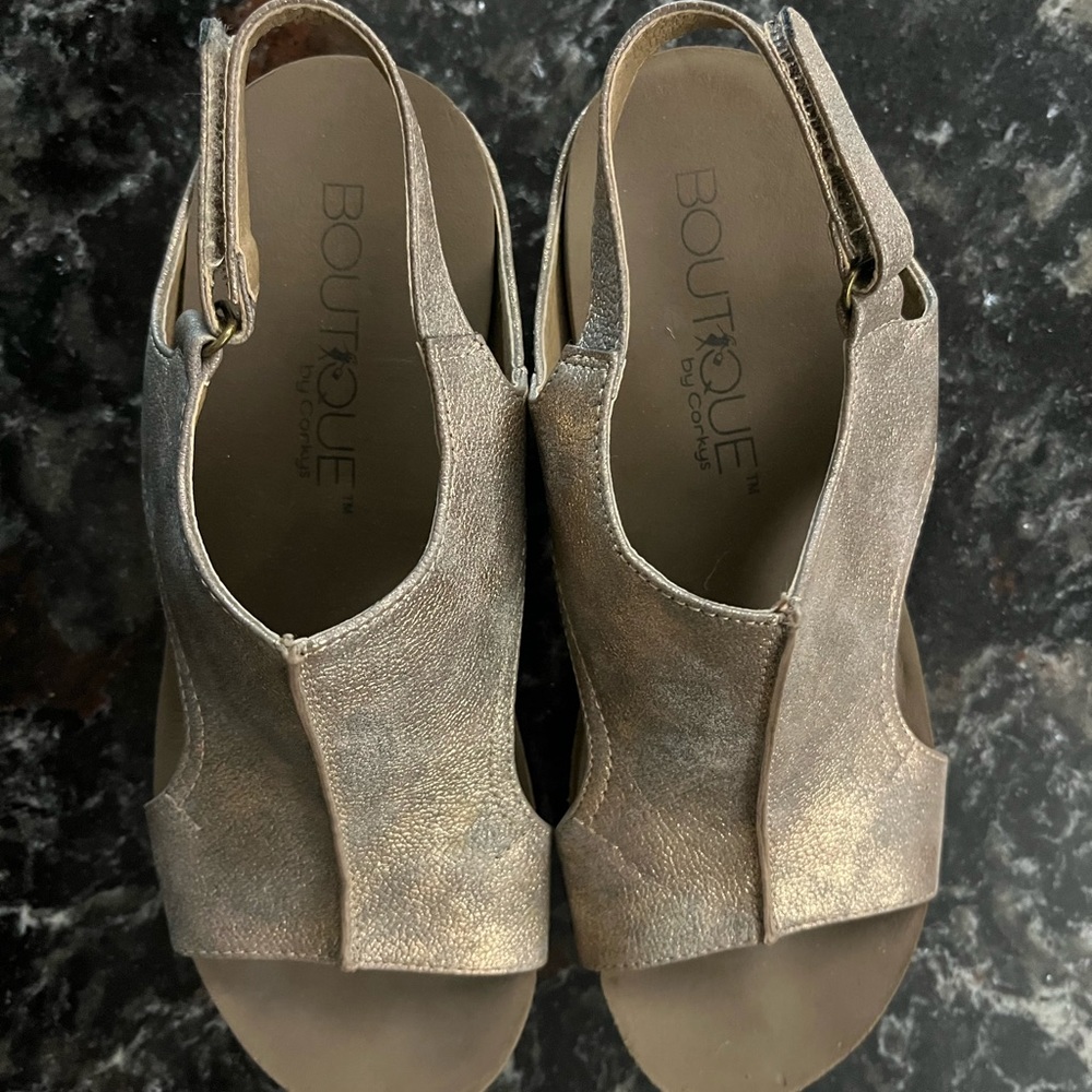 Corkys gently used size 7 Rose-Gold metalic wedge sandals. Super cute!!